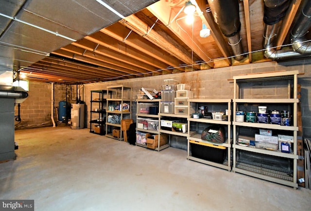 2415 Schaffer Rd, Pottstown, PA 19464 - unfinished basement with water heater and a water pressure tank