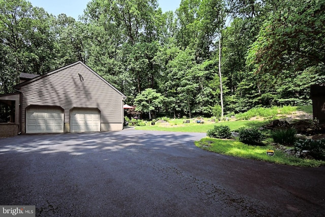 2415 Schaffer Rd, Pottstown, PA 19464 - view of side of property featuring asphalt driveway and an attached garage
