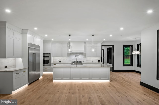 934 Chesterfield Rd, Annapolis, MD 21401 - kitchen with appliances with stainless steel finishes, recessed lighting, backsplash, premium range hood, and white cabinets