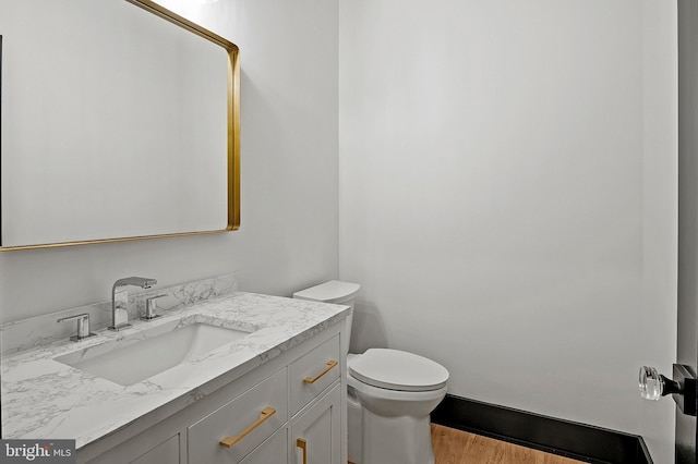 934 Chesterfield Rd, Annapolis, MD 21401 - half bathroom featuring vanity and wood finished floors