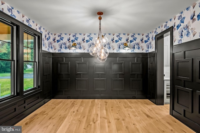 934 Chesterfield Rd, Annapolis, MD 21401 - foyer featuring wallpapered walls, wood finished floors, a wainscoted wall, a chandelier, and wine cooler