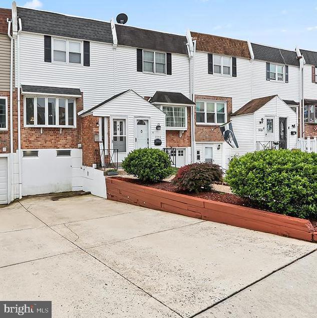 3721 S Hereford Ln, Philadelphia, PA 19114 - rear view of house featuring a residential view and brick siding