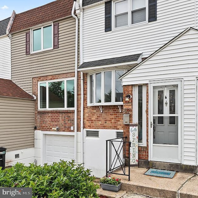 3721 S Hereford Ln, Philadelphia, PA 19114 - entrance to property featuring roof with shingles and brick siding
