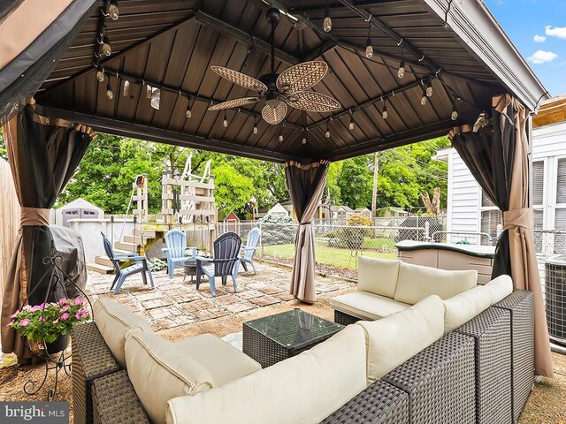 3721 S Hereford Ln, Philadelphia, PA 19114 - view of patio / terrace with an outdoor living space with a fire pit, a gazebo, and a ceiling fan