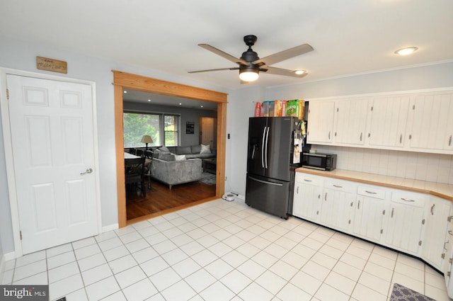 628 Mercer St, Cherry Hill, NJ 08002 - kitchen featuring black appliances, ceiling fan, light countertops, decorative backsplash, and light tile patterned floors