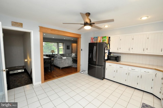 628 Mercer St, Cherry Hill, NJ 08002 - kitchen featuring black appliances, ceiling fan, light countertops, and white cabinetry