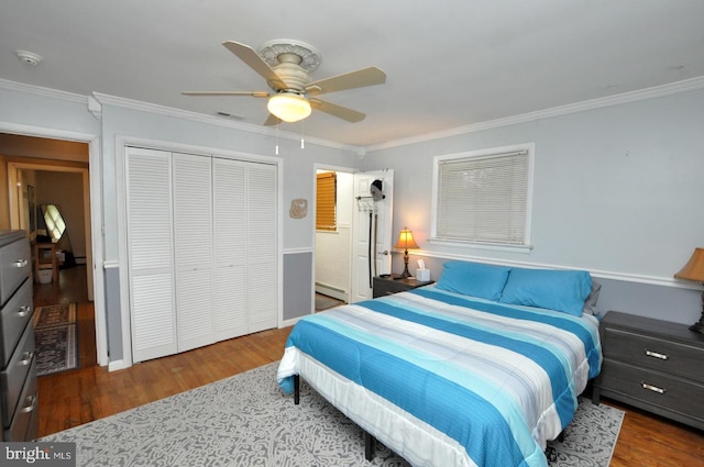 628 Mercer St, Cherry Hill, NJ 08002 - bedroom featuring wood finished floors, a baseboard radiator, crown molding, a closet, and ceiling fan