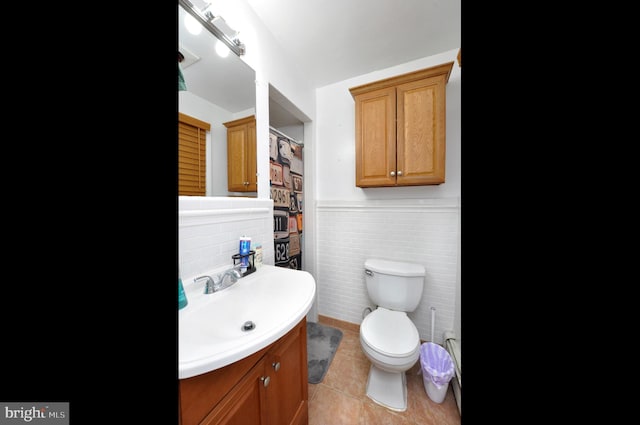628 Mercer St, Cherry Hill, NJ 08002 - bathroom featuring vanity, tile walls, tile patterned floors, toilet, and a wainscoted wall