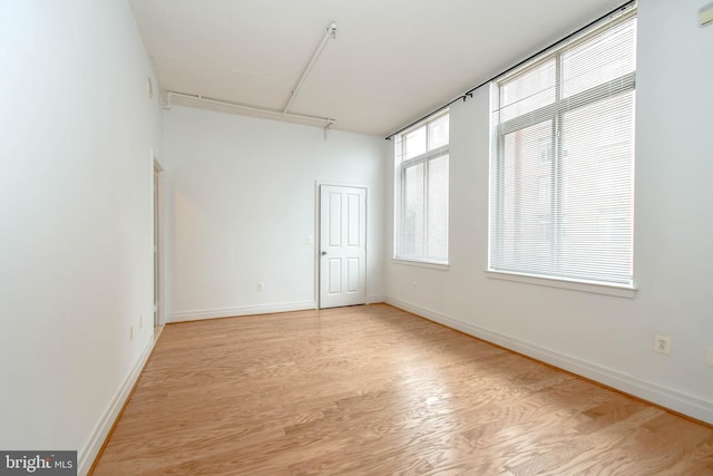 4490 Market Commons Dr Unit 302, Fairfax, VA 22033 - unfurnished room with light wood-type flooring and baseboards