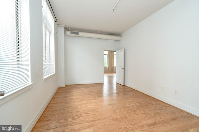 4490 Market Commons Dr Unit 302, Fairfax, VA 22033 - empty room with light wood-style flooring and baseboards