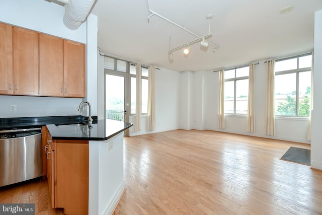 4490 Market Commons Dr Unit 302, Fairfax, VA 22033 - kitchen with dishwasher, a sink, dark countertops, open floor plan, and light wood finished floors