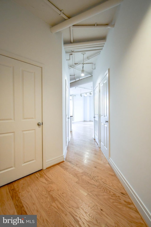 4490 Market Commons Dr Unit 302, Fairfax, VA 22033 - corridor featuring light wood-type flooring and baseboards
