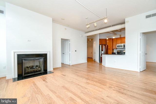 4490 Market Commons Dr Unit 302, Fairfax, VA 22033 - unfurnished living room featuring light wood finished floors and baseboards