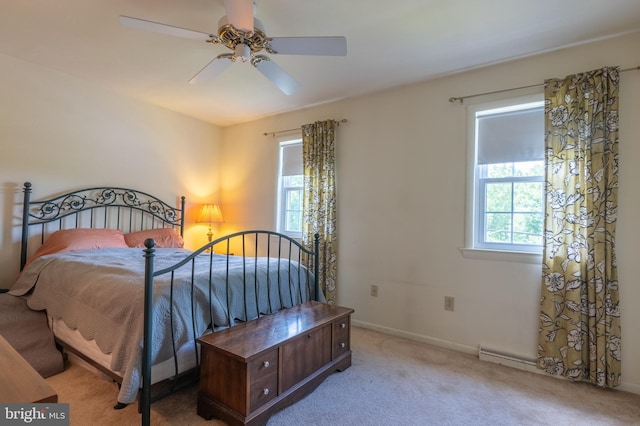 419 S Wyomissing Ave, Reading, PA 19607 - carpeted bedroom featuring multiple windows, baseboards, and a ceiling fan