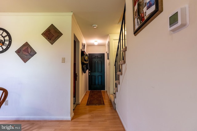 419 S Wyomissing Ave, Reading, PA 19607 - hall featuring light wood-style floors, stairs, baseboards, and crown molding