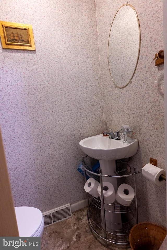 419 S Wyomissing Ave, Reading, PA 19607 - half bath featuring toilet and a sink