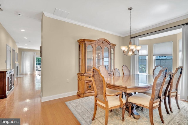 332 Blanketflower Ln, West Windsor, NJ 08550 - dining room with a chandelier, baseboards, light wood finished floors, ornamental molding, and recessed lighting