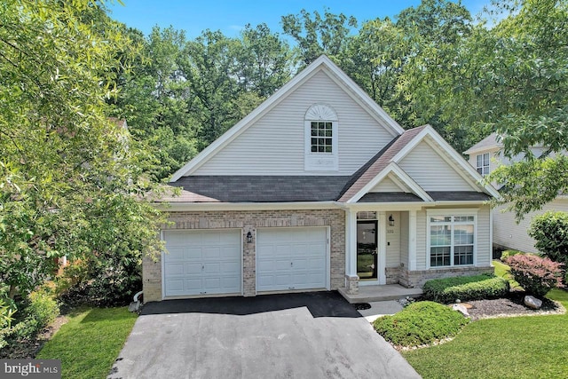 332 Blanketflower Ln, West Windsor, NJ 08550 - view of front of property featuring asphalt driveway, a garage, brick siding, and a shingled roof