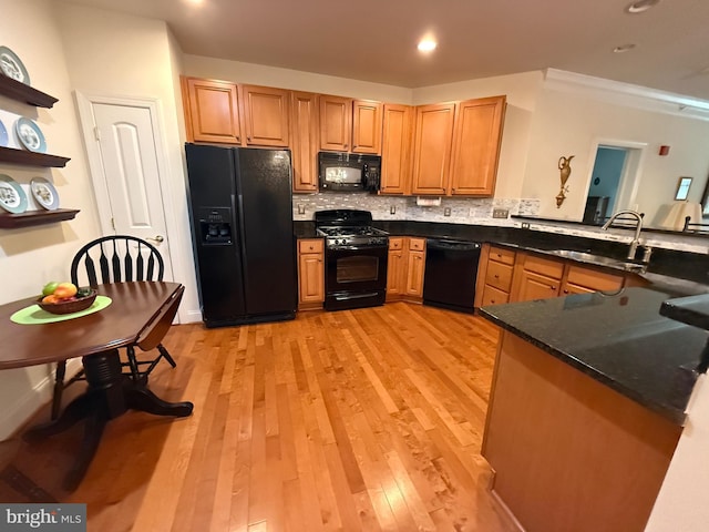 902 Macphail Woods Xing Unit 4F, Bel Air, MD 21015 - kitchen featuring black appliances, a sink, decorative backsplash, a peninsula, and light wood-style flooring