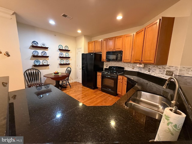 902 Macphail Woods Xing Unit 4F, Bel Air, MD 21015 - kitchen with black appliances, a sink, open shelves, backsplash, and brown cabinetry