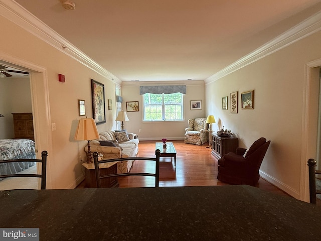 902 Macphail Woods Xing Unit 4F, Bel Air, MD 21015 - living area featuring wood finished floors, crown molding, and baseboards
