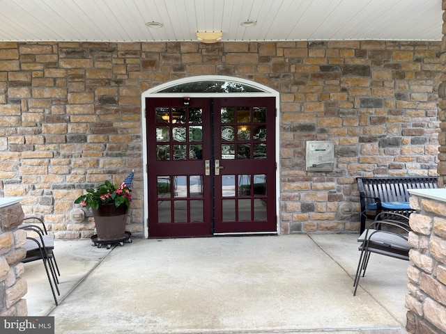 902 Macphail Woods Xing Unit 4F, Bel Air, MD 21015 - view of exterior entry featuring french doors and stone siding