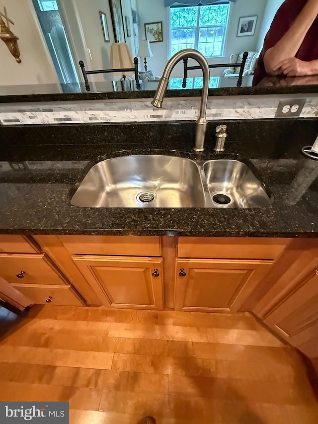 902 Macphail Woods Xing Unit 4F, Bel Air, MD 21015 - kitchen view of a sink and dark stone counters