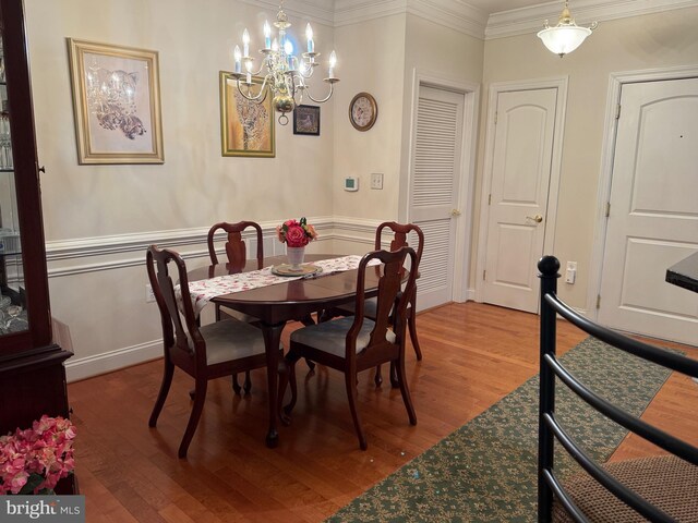 902 Macphail Woods Xing Unit 4F, Bel Air, MD 21015 - dining area featuring a chandelier, light wood-style floors, ornamental molding, and wainscoting