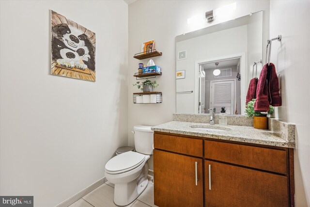 8005 13th St Unit 411, Silver Spring, MD 20910 - bathroom with vanity, toilet, tile patterned flooring, and baseboards