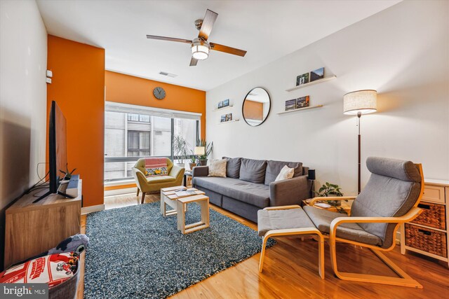 8005 13th St Unit 411, Silver Spring, MD 20910 - living area with wood finished floors and a ceiling fan