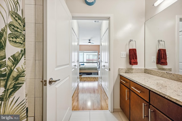 8005 13th St Unit 411, Silver Spring, MD 20910 - full bathroom with vanity, a ceiling fan, and wood finished floors