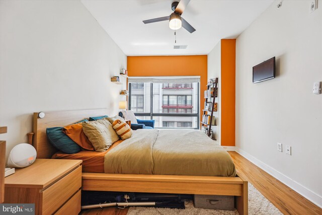 8005 13th St Unit 411, Silver Spring, MD 20910 - bedroom with wood finished floors, baseboards, and ceiling fan