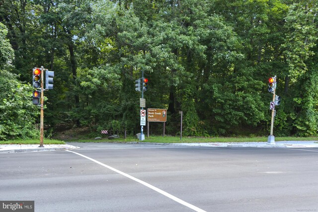8005 13th St Unit 411, Silver Spring, MD 20910 - view of asphalt street with traffic lights, traffic signs, and curbs