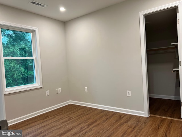 34 Hornets Nest Ln, Fredericksburg, VA 22405 - unfurnished bedroom with dark wood finished floors, a walk in closet, baseboards, and a closet