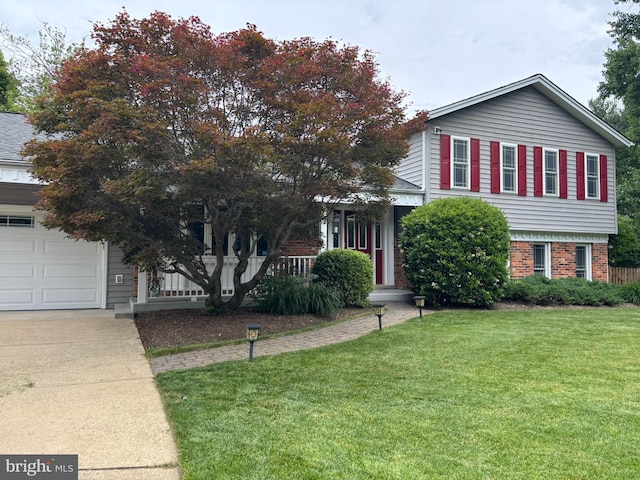 2404 Blue Valley Dr, Silver Spring, MD 20904 - view of front of house featuring a front yard, covered porch, brick siding, and concrete driveway