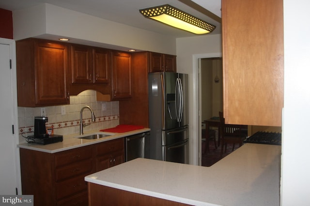 2404 Blue Valley Dr, Silver Spring, MD 20904 - kitchen featuring stainless steel appliances, a sink, tasteful backsplash, light countertops, and a peninsula