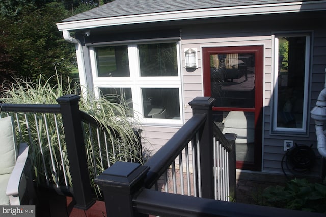 2404 Blue Valley Dr, Silver Spring, MD 20904 - view of exterior entry featuring a shingled roof and a balcony