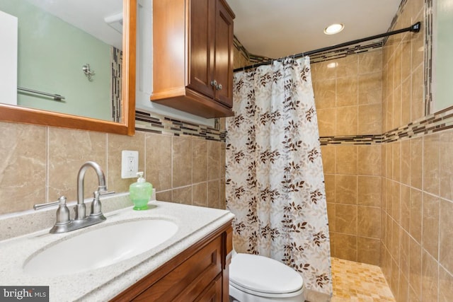 11617 Smithfield Rd, Manassas, VA 20112 - bathroom with tiled shower, vanity, toilet, and backsplash
