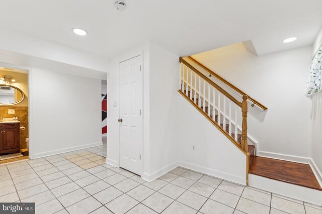 11617 Smithfield Rd, Manassas, VA 20112 - staircase with tile patterned flooring, baseboards, and recessed lighting