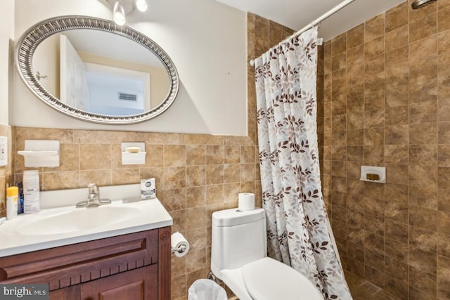 11617 Smithfield Rd, Manassas, VA 20112 - full bathroom featuring vanity, a tile shower, toilet, and tile walls