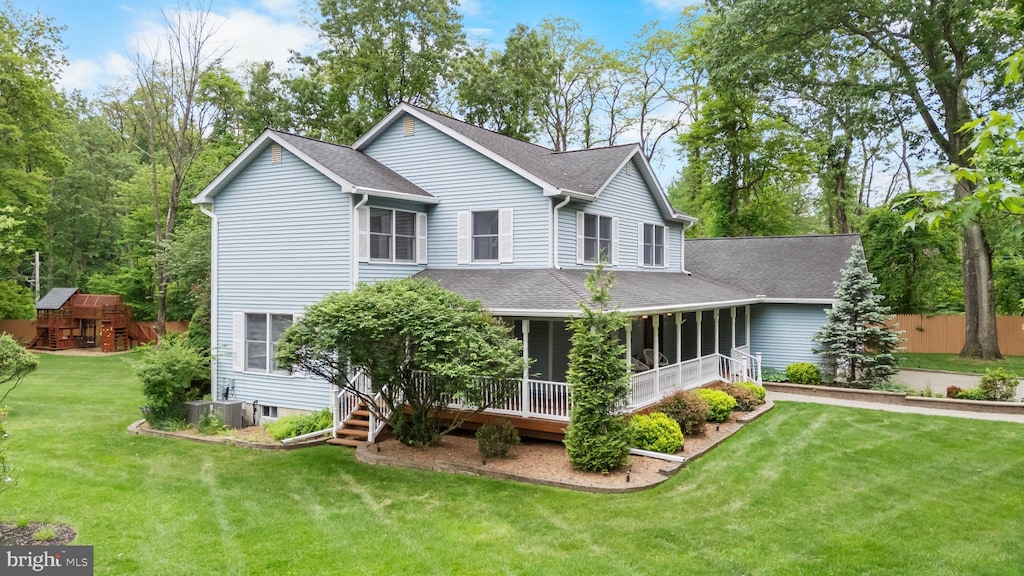 9 Castaby, Mount Tabor, NJ 07878 - view of front of house featuring a shingled roof, a front yard, a sunroom, and central AC unit