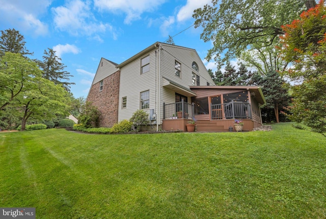 727 Hemlock Rd, Media, PA 19063 - back of property featuring a sunroom and a yard