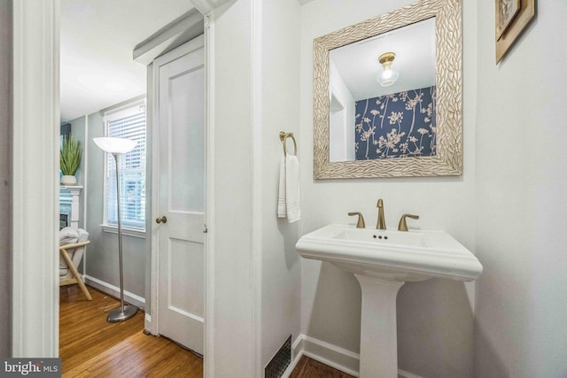 727 Hemlock Rd, Media, PA 19063 - bathroom with baseboards and wood finished floors