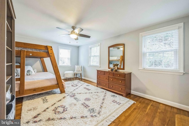 727 Hemlock Rd, Media, PA 19063 - bedroom with baseboards, wood finished floors, and a ceiling fan