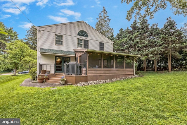 727 Hemlock Rd, Media, PA 19063 - rear view of property with a sunroom and a yard