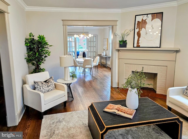 110 Varnum St NW, Washington, DC 20011 - living area featuring a chandelier, crown molding, wood finished floors, a fireplace, and baseboards