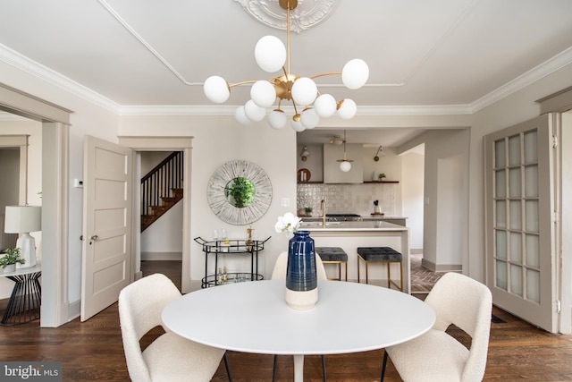 110 Varnum St NW, Washington, DC 20011 - dining room featuring stairs, dark wood-style flooring, baseboards, crown molding, and a chandelier