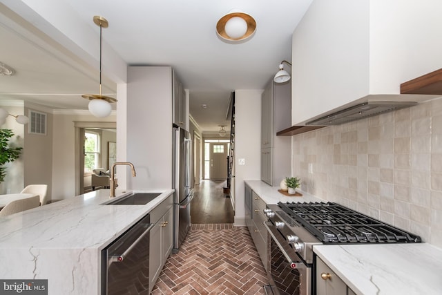 110 Varnum St NW, Washington, DC 20011 - kitchen with custom range hood, stainless steel appliances, a sink, gray cabinetry, and brick floors