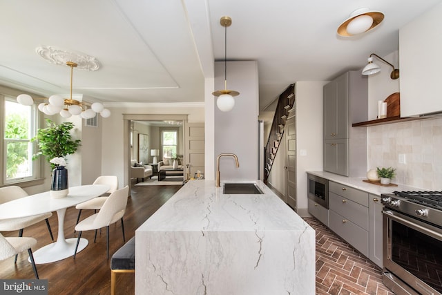 110 Varnum St NW, Washington, DC 20011 - kitchen featuring gray cabinetry, a sink, stainless steel appliances, tasteful backsplash, and ornamental molding