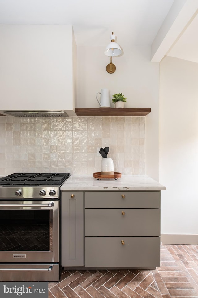 110 Varnum St NW, Washington, DC 20011 - kitchen featuring gas stove, gray cabinetry, backsplash, open shelves, and extractor fan